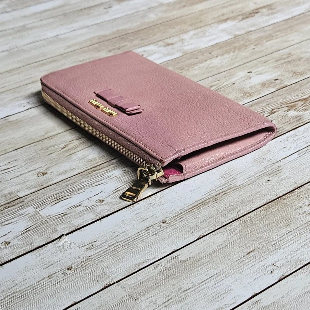 Miu Miu Pink Wallet with Elegant Zip Closure